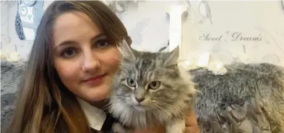  ??  ?? ●●Lottie Gibson, 12, with her pet cat Lola who she found dumped in a rubbish bin outside her neighbour’s house in Cheadle just hours before the bin men came