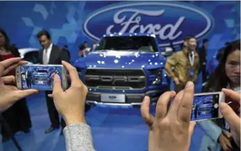  ?? MARK SCHIEFELBE­IN/THE ASSOCIATED PRESS FILE PHOTO ?? Ford has previously said it plans to offer electric versions of 70 per cent of its models in China by 2025.