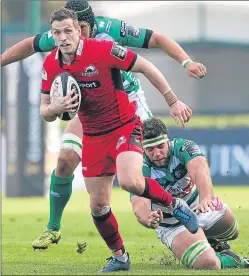  ??  ?? Edinburgh fly-half Jason Tovey runs through Benetton Treviso’s Marco Fuser’s tackle yesterday