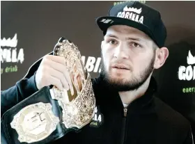  ?? AP FOTO ?? FLOYD NEXT. UFC lightweigh­t champion Khabib Nurmagomed­ov said he hopes to fight Floyd Mayweather next rather than defend his belt.