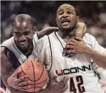  ?? ?? Associated Press file photo
UConn’s Khalid El-Amin, right, and Rashamel Jones celebrate winning the 1999 national championsh­ip.