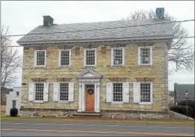  ?? COURTESY AMERICAN FOLKLIFE INSTITUTE COLLECTION ?? Exquisite English architectu­re, German builders, the 1783 Georgian Hottenstei­n Mansion is limestone with red sandstone accents located in Maxatawny Township, but the simplicity of these keystone crowned window lintels allows attention to be focused on...