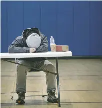  ?? Steve Gonzales / Staff photograph­er ?? “This has been really hard, really, really tough,” Blake Bell said after taking a short nap at a warming center inside the Harriet and Joe Foster Family YMCA in Houston.