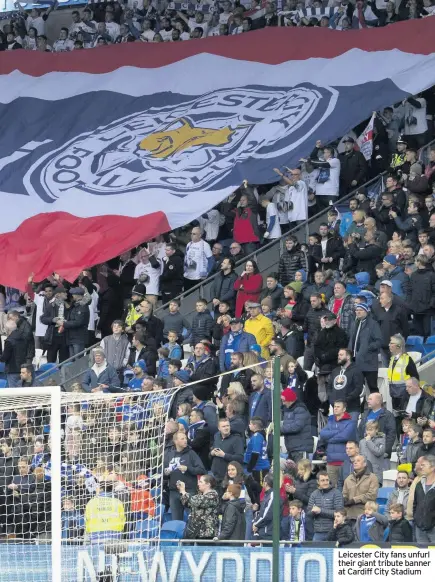  ??  ?? Leicester City fans unfurl their giant tribute banner at Cardiff City Stadium