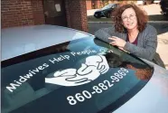  ?? ?? Midwife Carolyn Greenfield with her car outside of her Rocky Hill office. She says the sticker on her rear window has generated some contacts.