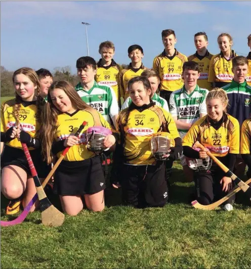  ??  ?? Players from St Fechin’s and Scottish visitors Uddingston Grammar School line up after their hurling/shinty challenge match in sunny Termonfeck­in