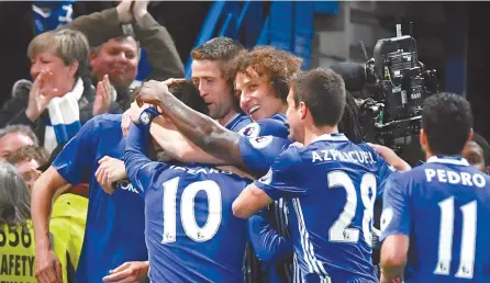  ?? EPA-Yonhap ?? Chelsea players celebrate the 3-0 goal during the English Premier League football match against Middlesbor­ough FC at Stamford Bridge in London, Britain, Monday.