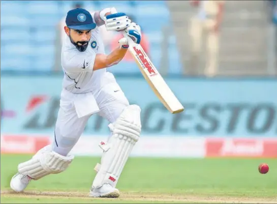  ?? AFP ?? ■ Going by the way Virat Kohli was middling the ball when he declared, he could have easily had a go at his maiden triple century. He didn’t. Nonetheles­s, records tumbled.