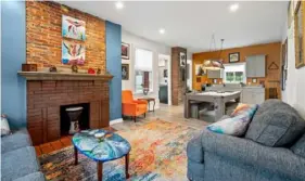  ?? Fly Over Properties ?? The three-bedroom house features exposed brick at 1503 Gardner St. in Troy Hill.