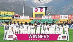  ?? ?? The India team poses with the Test series trophy in Dharamsala and (top) Rohit Sharma led the way both with the bat and with smart captaincy through the series.