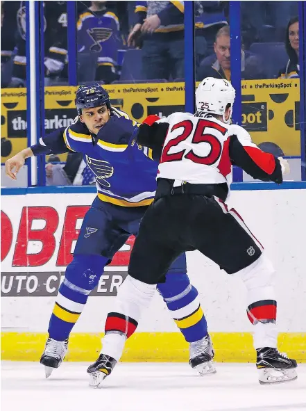  ?? — THE ASSOCIATED PRESS FILES ?? Ryan Reaves, seen here with the Blues fighting Ottawa’s Chris Neil in January, will be on guard to protect new teammate Sidney Crosby after being acquired by Pittsburgh.