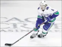  ?? CP PHOTO ?? Vancouver Canucks right wing Brock Boeser ( 6) is shown during overtime of an NHL game against the San Jose Sharks last week in San Jose, Calif.