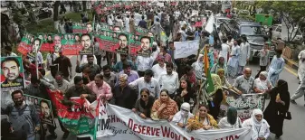  ?? K.M. Chaudary / Associated Press ?? Protesters rally in Lahore, Pakistan, on Monday in support of autonomy for the Indian Kashmiri people. India just revoked Article 370, which had given Kashmir the right to make its own laws.