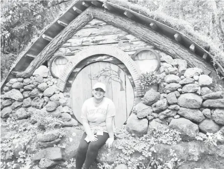  ?? (PHOTO FROM SHEVANIE MAGALLANES/DOST10) ?? DOST staff pose in front of a hobbit house design at Mt. Kitanglad Agro Eco-Tourism (MKAET) in Malaybalay City Bukidnon.