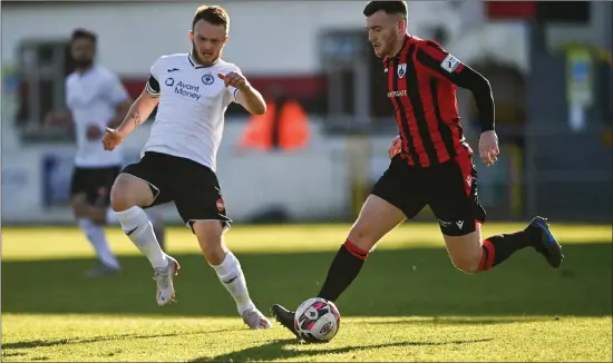  ??  ?? David Cawley chases Joe Gorman of Longford Town. Pic: Harry Murphy/Sportsfile