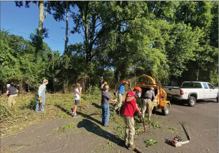  ?? PHOTO SUBMITTED BY KYLE BOYD ?? Volunteers assist with Jake Boyd’s Eagle Scout project clearing a tree line at St. Dunstan’s Church in Blue Bell.