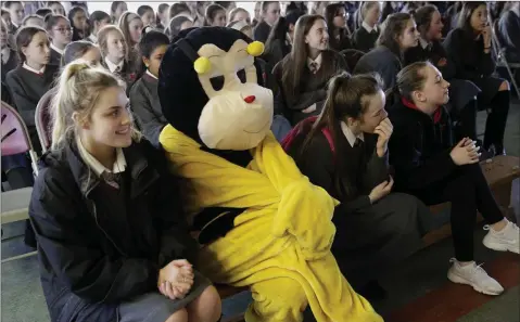  ??  ?? Loreto girls watching the Spelling Bee competitio­n, with ‘Bee-ance’ paying close attention during the competitio­n.