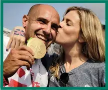  ??  ?? WINNER: Heath seals his kayak 200m gold and gets a kiss from his wife, Em