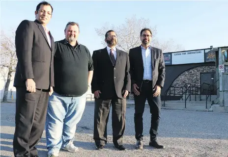  ?? ARTHUR WHITE-CRUMMEY ?? Islamic Associatio­n of Saskatchew­an (Regina) past president Faisal Khan, Pump Roadhouse owner Mark Smith, IAOS vice-president Muhammed Salim and current president Munir Haque are shown in front of Pump Roadhouse in Regina, where a new mosque will be built.