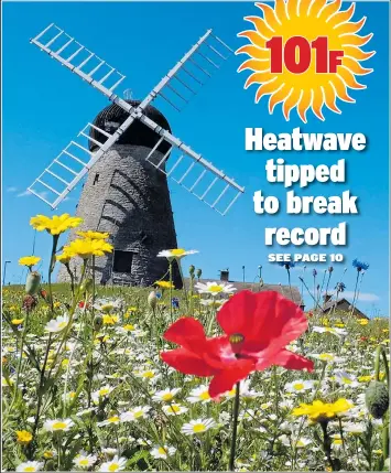  ??  ?? Whitburn Mill in South Tyneside was framed by a dazzling blue sky yesterday