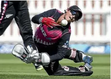  ?? GETTY IMAGES ?? Katey Martin dives to field the ball during the White Ferns’ recent T20 series against South Africa.