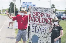  ?? MICHAEL CONROY — THE ASSOCIATED PRESS ?? Protesters against the death penalty gather in Terre Haute, Ind., on Monday. Daniel Lewis Lee, a convicted killer, was executed Monday in the federal prison in Terre Haute. He was convicted in Arkansas of the 1996 killings of gun dealer William Mueller, his wife, Nancy, and her 8-year-old daughter, Sarah Powell.