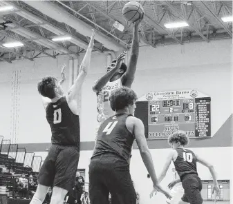  ?? Kirk Sides / Staff photograph­er ?? Lorenzo Waddy, top, scored 23 points to lead Dawson to a rout of Clear Springs in Tuesday’s Class 6A boys bi-district playoff matchup.