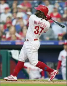  ?? THE ASSOCIATED PRESS ?? The Phillies’ Odubel Herrera follows through on a threerun home run in the first inning of Monday’s win over the Giants.