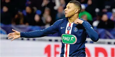  ?? File / Agence France-presse ?? ↑ Kylian Mbappe has clearly indicated his importance at PSG with a hat-trick in 5−1 French Cup semi-final win at Lyon on Wednesday.