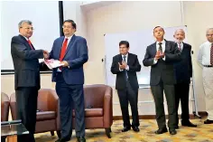  ??  ?? Chairman of the Research Committee Mr. Nishan Fernando presenting a copy of the CA Journal of Applied Research to CA Sri Lanka Vice President Mr. Manil Jayesinghe in the presence of Prof. Kapila Perera, Prof. Dissa Bandara, Mr. Chandra Jayaratne and Mr. Prasanna Liyanage.