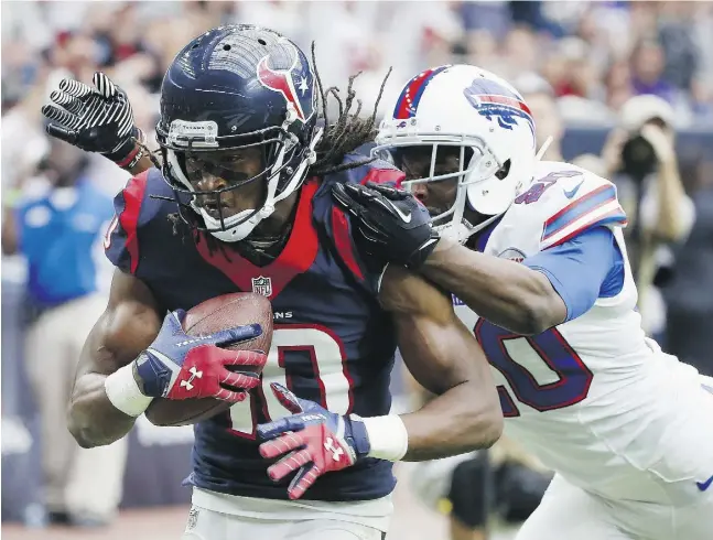  ?? Scott Haleran / Gett
y Imag
es ?? Houston’s DeAndre Hopkins pulls away from the Bills’ Corey Graham for a second-quarter touchdown in the Texan’s victory at home on Sunday.