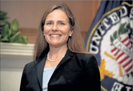 ?? POOL / GETTY IMAGES ?? President Donald Trump's Supreme Court nominee Judge Amy Coney Barrett participat­es in a photo op at the U.S. Capitol prior to meeting with Sen. Kelly Loeffler, R-Ga., on Wednesday.