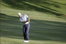  ?? AP photo ?? Lee Westwood chips to the ninth green during the second round of the The Players Championsh­ip on Friday.