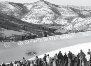  ?? Press file David J. Phillip, Associated ?? Spectators watch the men’s single luge competitio­n during the 2002 Salt Lake City Winter Olympics in Park City, Utah, on Feb. 10, 2002. A committee has begun discussing whether Colorado should place a bid to host the 2026 or 2030 Winter Games.