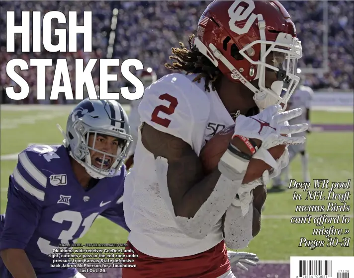  ?? CHARLIE RIEDEL - FOR THE ASSOCIATED PRESS ?? Oklahoma wide receiver CeeDee Lamb, right, catches a pass in the end zone under
pressure from Kansas State defensive back Jahron McPherson for a touchdown
last Oct. 26.