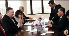  ?? AP/SETH WENIG ?? Kim Yong Chol (right), a former North Korean military intelligen­ce chief and one of leader Kim Jong Un’s closest aides, sits across from U.S. Secretary of State Mike Pompeo during Thursday’s meeting in New York.