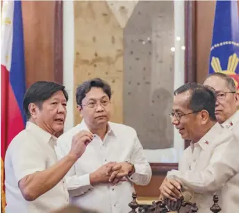  ?? PHOTOGRAPH BY YUMMIE DINGDING FOR THE DAILY TRIBUNE @tribunephl_yumi ?? PRESIDENT Ferdinand Marcos Jr. talks to Cabinet officials during the 14th NEDA Board Meeting on Tuesday at Malacañang.