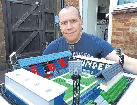  ??  ?? A MAN refuses to “Lego” of a favour- ite childhood pastime — and has now erected a sculpture of the city’s Dens Park using the plastic bricks.
One rainy day, Cardiff City fan Julian Richards, a supermarke­t manager from Luton, broke out an old set of...