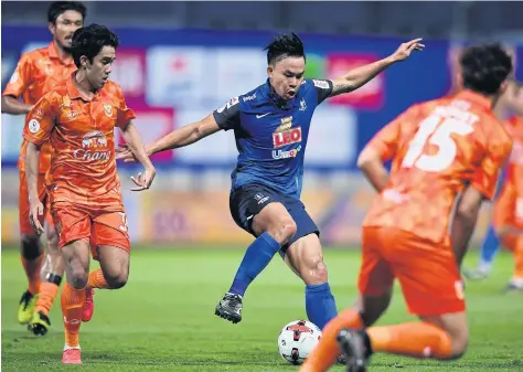  ??  ?? BG Pathum midfielder Sumanya Purisay in action during the match against Sukhothai.
