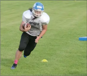  ?? NEWS PHOTO RYAN MCCRACKEN ?? Crescent Heights Vikings fullback Creed Willette takes part in a drill during a football practice on Friday at Crescent Heights High School.