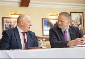  ?? ?? Right: Andrew Muir, Agricultur­e Minister, having a discussion with David Brown, President, UFU at the Lough
Erne Resort.