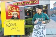  ?? Cassandra Day / Hearst Connecticu­t Media file photo ?? Activists protest outside a Wells Fargo bank branch in Middletown in 2017.