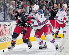  ?? DISPATCH ?? BARBARA J. PERENIC The Blue Jackets’ Scott Hartnell, left, and the Rangers’ Dan Girardi fight for the puck.