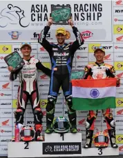  ??  ?? Anthony West ( centre), winner of the SuperSport 600 race, is flanked by second- placed Md Zaqhwan Zaidi ( left) and Taiga Hada at the FIM Asia Road Racing Championsh­ip at the MMRT in Chennai on Saturday.