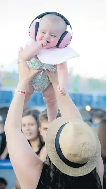  ?? ASHLEY FRASER ?? Seven-month-old Scotlynn Dekoning and her mom Brittany Dekoning at Bluesfest on Thursday.