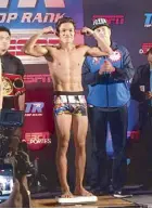  ??  ?? Ancajas tips the scales at 114 3/4 pounds during the weigh-in