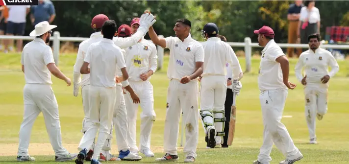  ??  ?? Glimmer of hope Hamza Tahir receives the plaudits after taking another wicket