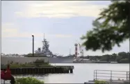  ?? MARCO GARCIA—ASSOCIATED PRESS ?? A U.S. naval ship can been seen from Pearl Harbor National Memorial Wednesday, Dec. 4, 2019, in Honolulu. A U.S. sailor shot and wounded several civilian Department of Defense employees at the Pearl Harbor shipyard Wednesday before taking their own life, the military said. Joint Base Pearl Harbor-Hickam, one of the Navy’s major installati­ons, said the shooting began around 2:30p.m. at Pearl Harbor Naval Shipyard.