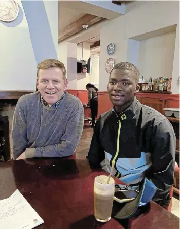  ?? Picture: SANDY BIRCH ?? POWER TEAM: Talented sportsman Othimna Matawana with his gold ‘dad’ Dr Leon Nel at a meet and greet session at the Royal St Andrew’s Hotel this week