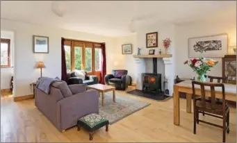  ??  ?? The spacious dining/ living room as double doors leading to a patio and also a solid fuel stove.